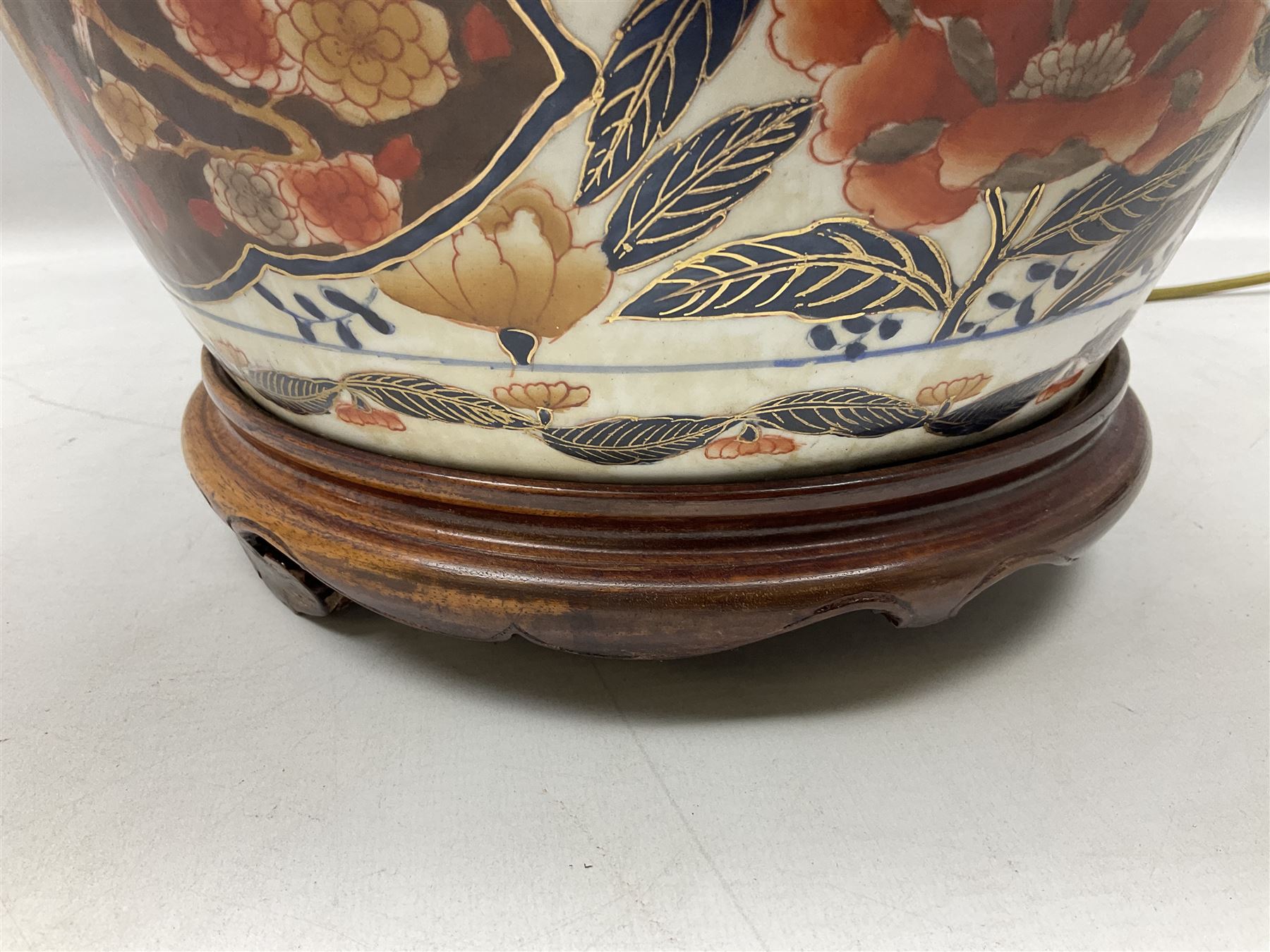 Pair of large and impressive 20th century Japanese Imari table lamps, each of ovoid form, decorated in the Imari palette with roundels containing flowering urns, and shaped panels of birds, set against a white ground decorated with blossoming peonies, lamp base (not including fixtures) H56.5cm overall including shade H89cm