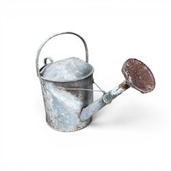 Eight early 20th century galvanised watering cans