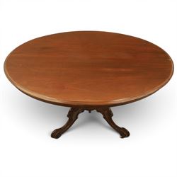 Victorian mahogany oval centre table, raised on turned column with four carved legs, ceramic castors