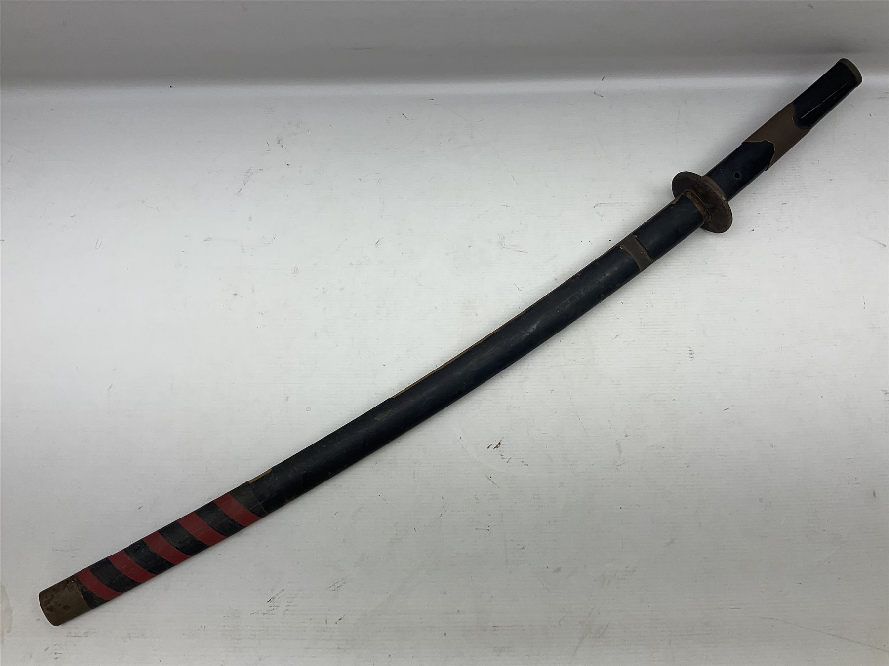 Good quality Japanese sword blade with later WWII fittings and scabbard  - 67.5cm slightly curving blade with unmarked tang, plain iron tsuba and lacquered grip with copper mounts; in lacquered wooden scabbard with tape bound tip L94cm overall