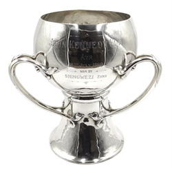  Arts and Crafts silver trophy, three handles by Carrington & Co (John Bodman Carrington) London 1900, later inscription 'John Kennedy Cup AYR 18th July 1960 won by Shingwezi 2yrs', H25.5cm, approx 69oz  
