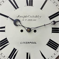 Joseph Critchley of Liverpool -  early 19th century twin fusee 8-day rosewood and mother of pearl inlaid drop-dial wall clock c1820, inlaid circular wooden dial surround with carved ears representing grapes and vine leaves, glazed box with a scroll carved surround, curved base and pendulum adjustment door, 14” painted dial with Roman numerals, minute track, and pierced steel hands within a cast brass bezel and flat glass, dial pinned to a four pillar chain driven fusee movement striking the hours on a bell. With pendulum and key.