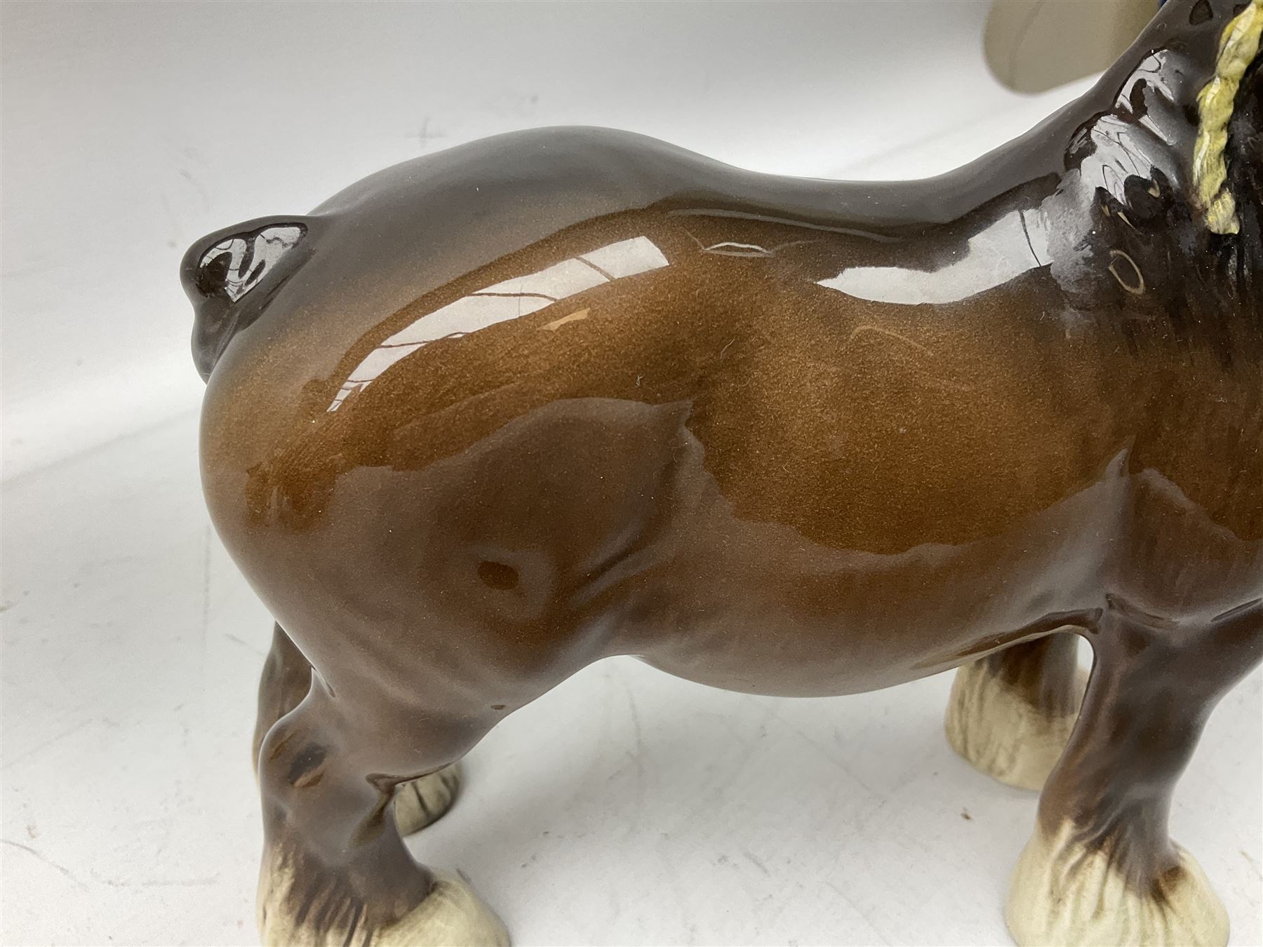 Three Beswick models comprising Hereford Bull no 949, 'CH Cutmil Cupie' Pug, and bay Shire horse, all with printed marks beneath