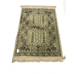 Persian design lime ground rug, repeating border, 140cm x 98cm