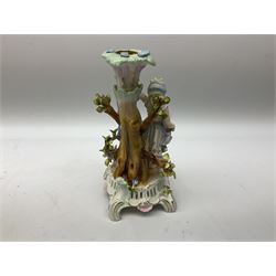 Early 20th century Sitzendorf porcelain centrepiece, the pierced floral encrusted bowl supported on a tree formed pedestal with two children playing, H34cm