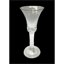 18th century drinking glass, the bell shaped bowl raised upon a plain stem with internal tear and conical foot, H16.5cm