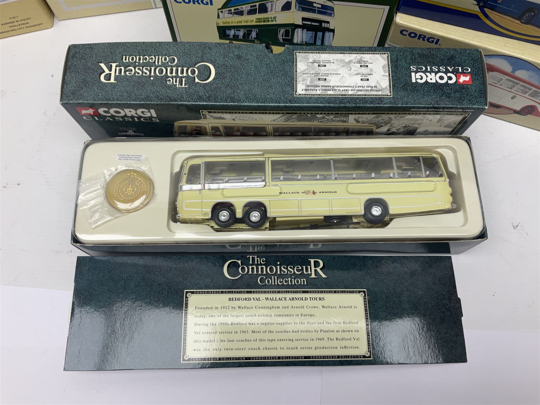 Corgi - twenty eight modern die-cast model coaches, buses and wagons to include Corgi Classics 35305, 96991, 97002, two 97108, 97208, 97267, 97335, 97871 and 98162; limited edition sets D949/26, 97107 and 97185; The Yorkshire Rider Series 91700, 91853, 91858 and 91862; all but one in original boxes or perspex display cases, most with certificates (27)