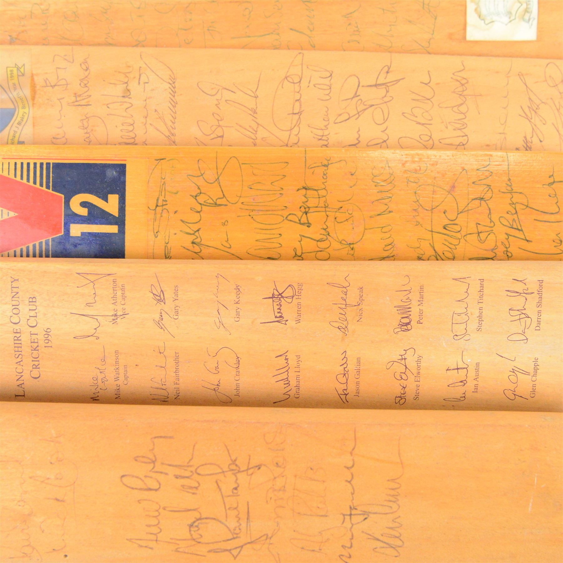 Sixteen signed miniature cricket bats, signed by 1990s County Cricket teams, including Northamptonshire 1992, Lancashire 1996, Surrey 1994, Essex 1991, Richard Blakely Benefit 1998, Worcester 1990 and Glamorgan 1994