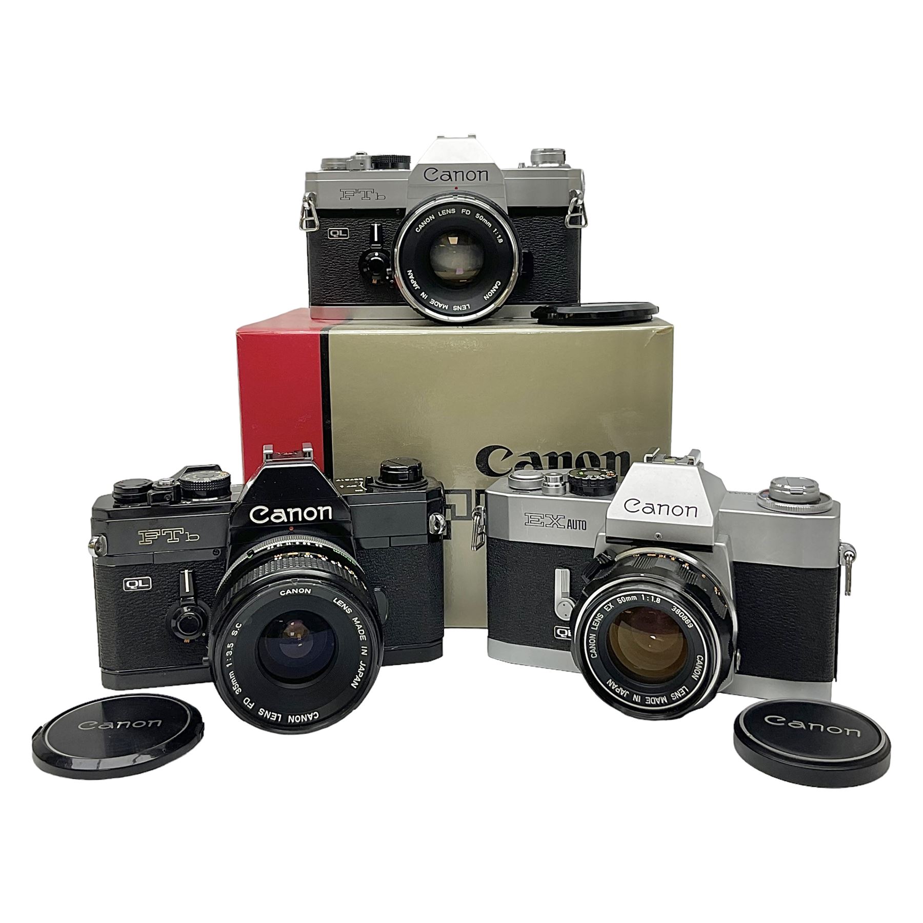 Canon FTb camera body, serial no. 715838, with 'Canon FD 50mm 1:1.8' lens, serial no. 207888, in original box, together with Canon FTb camera body, serial no. 557817, with 'Canon FD 35mm 1:3.5 S.C' lens, serial no. 126210 and Canon EX Auto camera body, serial no. 296244 with 'Canon EX 50mm 1:1.8' lens, serial no. 380869  