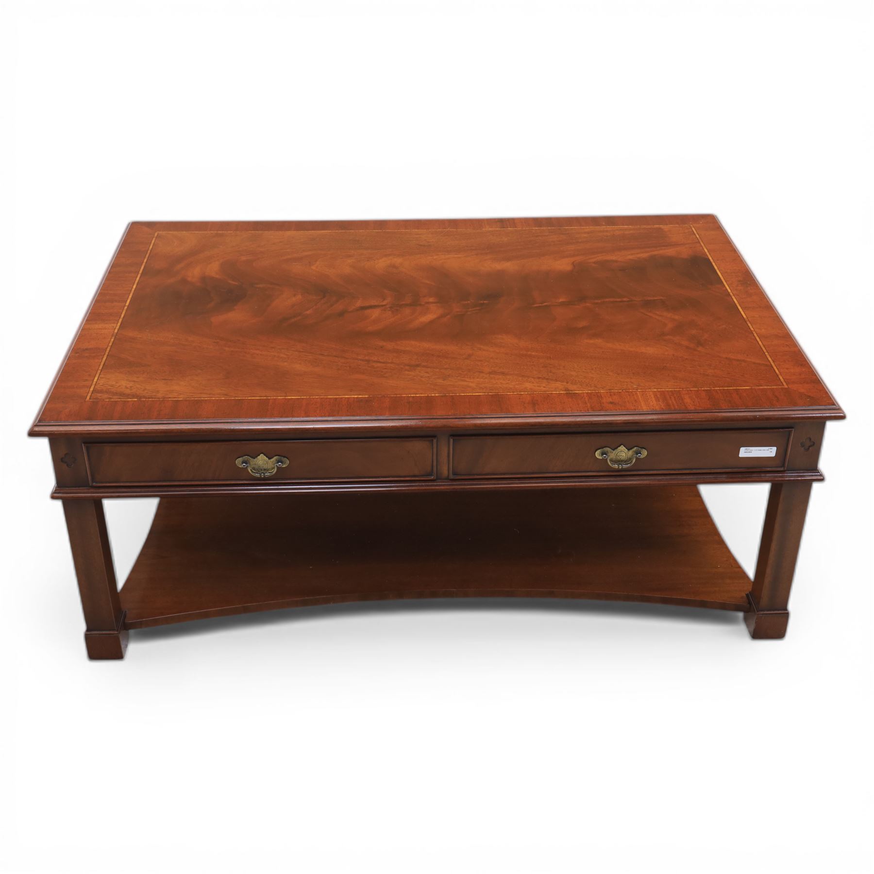 Georgian style mahogany coffee table, rectangular moulded top with crossbanded border and line inlay, fitted with two cock-beaded frieze drawers with ornate brass swan neck handles and shaped backplates, opposing false drawer fronts, raised on square tapering supports united by a concave undertier
