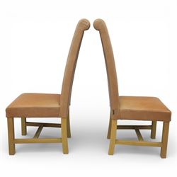 Modern large oak plank top dining table and twelve brown leather high back chairs, table of rustic construction five solid planks with exposed supports, the chairs in brown leather hide with ten standard height and a pair of taller chairs for the foot and head of the table