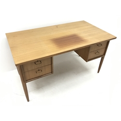  Mid 20th century retro teak desk, four drawers, turned supports, 'Morris of Glasgow', W137cm, H75cm, D77cm  