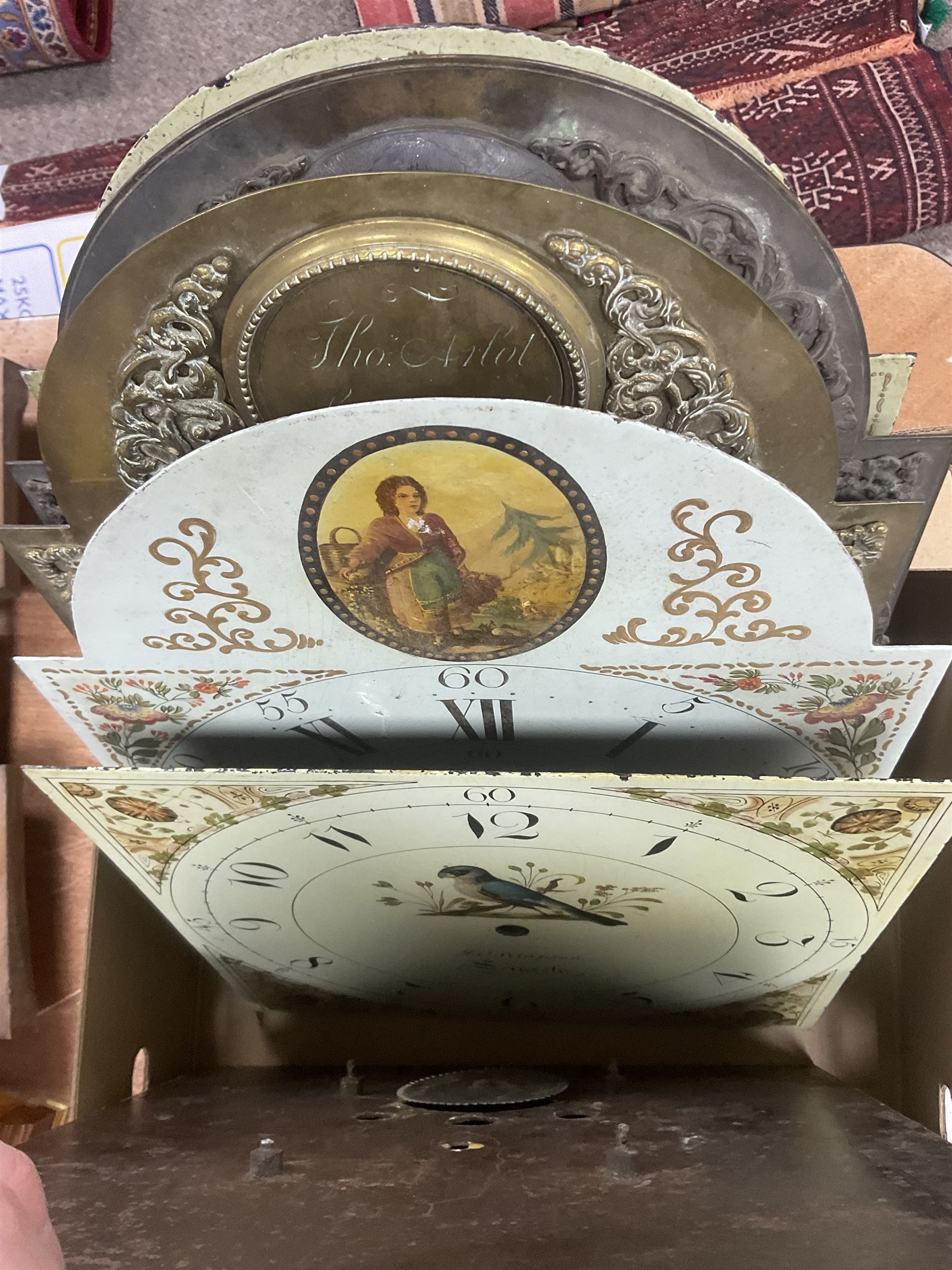 Approximately thirteen longcase clock faces, mainly 18th and 19th century, including brass and painted dials