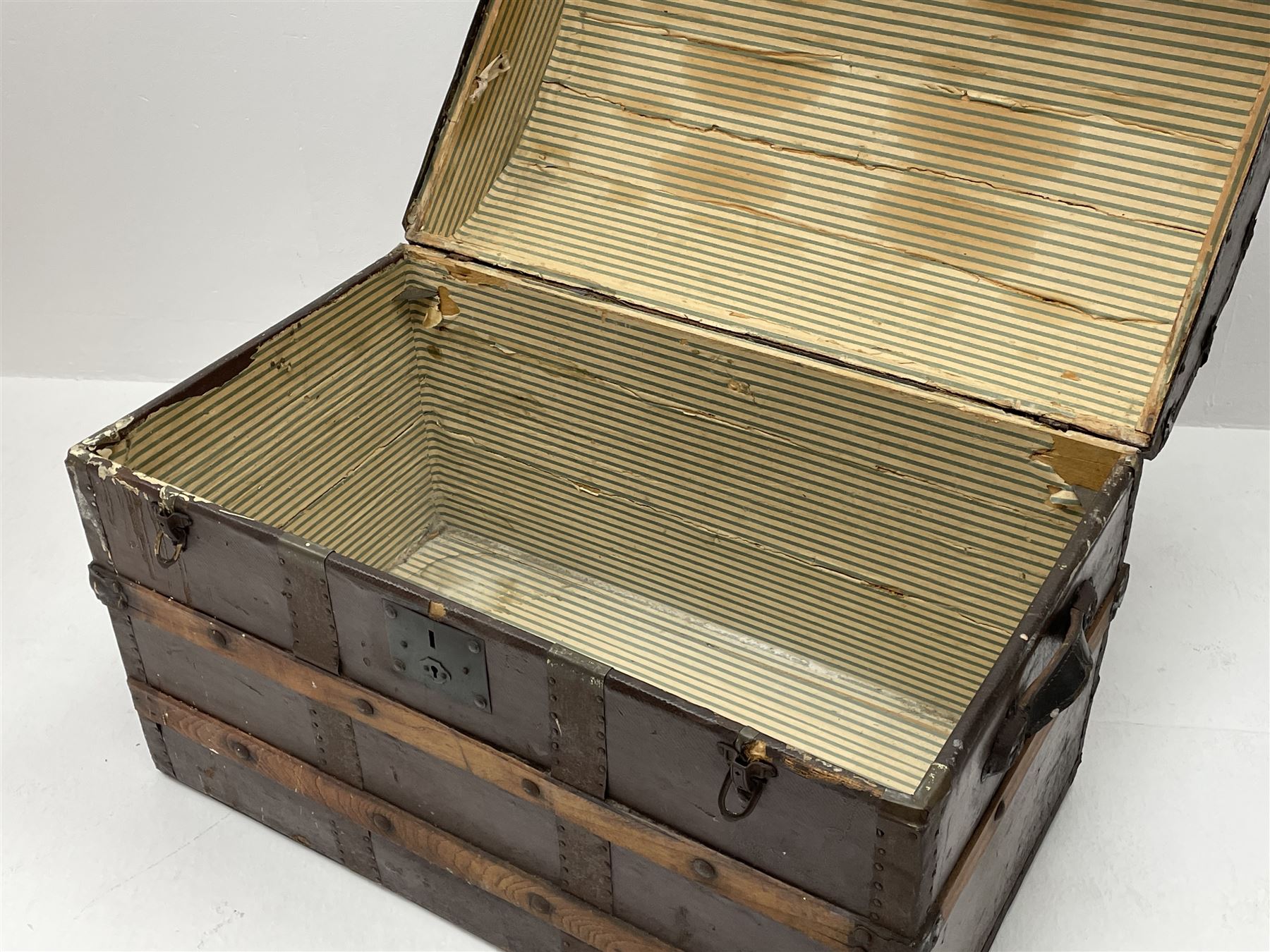 Early 20th century wood and metal bound trunk with dome hinged top