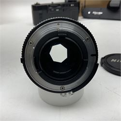 Nikon F3T camera body, in champagne/ titanium colourway, serial no. T8215031, with 'Nikon Nikkor 50mm 1:1.4' lens, Nikon MD4 motor drive, serial no. 156592 and Nikon MK-1 Firing range converter, all with original boxes 