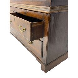 George III oak livery cupboard, projecting moulded cornice over two panelled doors, the upper panels within stepped ogee and arched moulded frame, the interior fitted with a single row of wooden hooks, two short and one long drawers, on bracket and return skirted base 