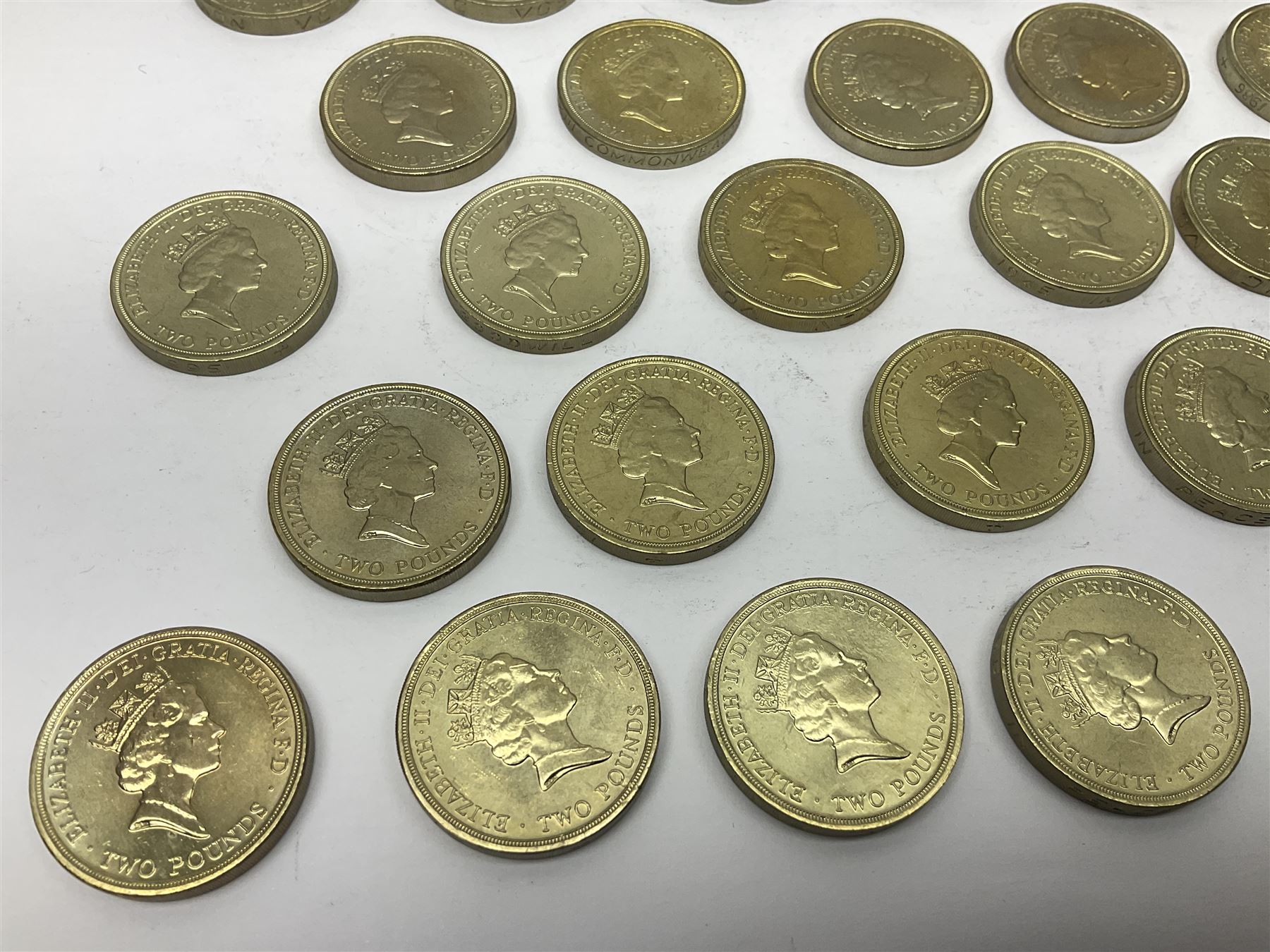 Twenty-eight Queen Elizabeth II old style two pound coins, including 1994 'Bank of England' etc