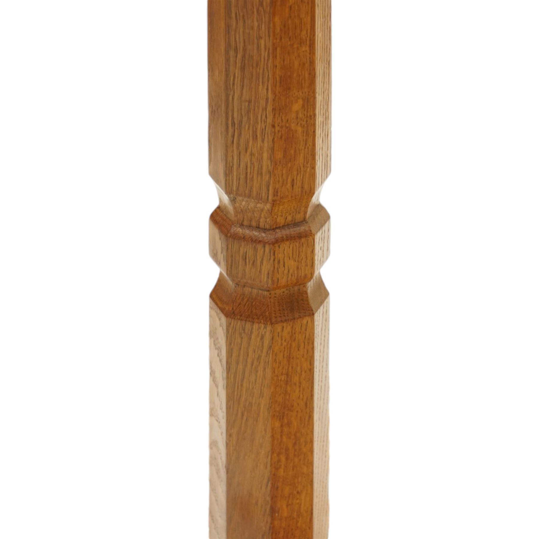 Mouseman - oak standard lamp, the turned octagonal column terminating to a stepped cavetto octagonal base, with carved mouse signature, by the workshop of Robert Thompson of Kilburn
