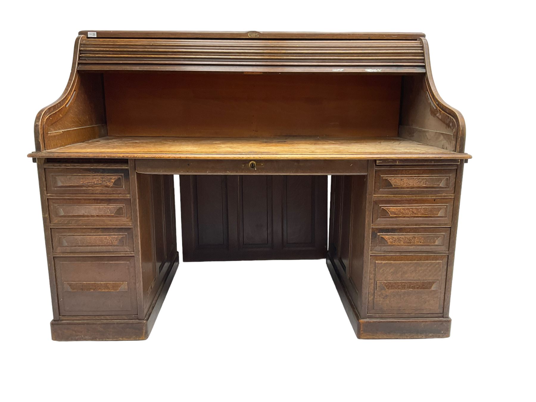Cutler - early 20th century American oak tambour roll-top desk, the twin pedestals fitted with four graduating drawers