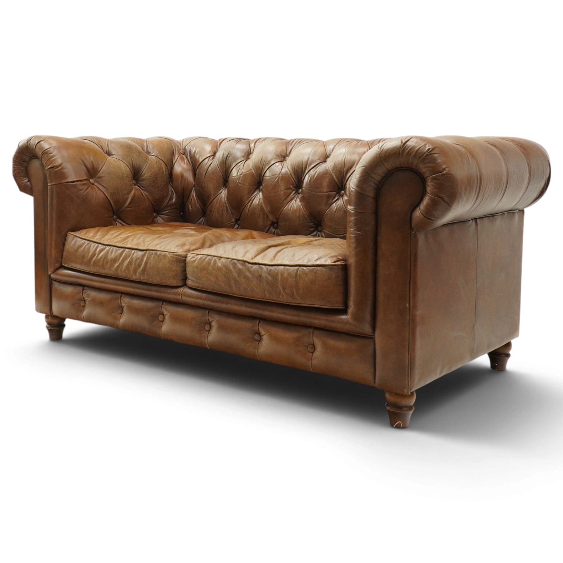 Timothy Oulton for Halo - two seater brown leather chesterfield settee, of traditional shape with rolled back and arms, upholstered in back-buttoned tan leather with loose seat cushions, raised on turned feet