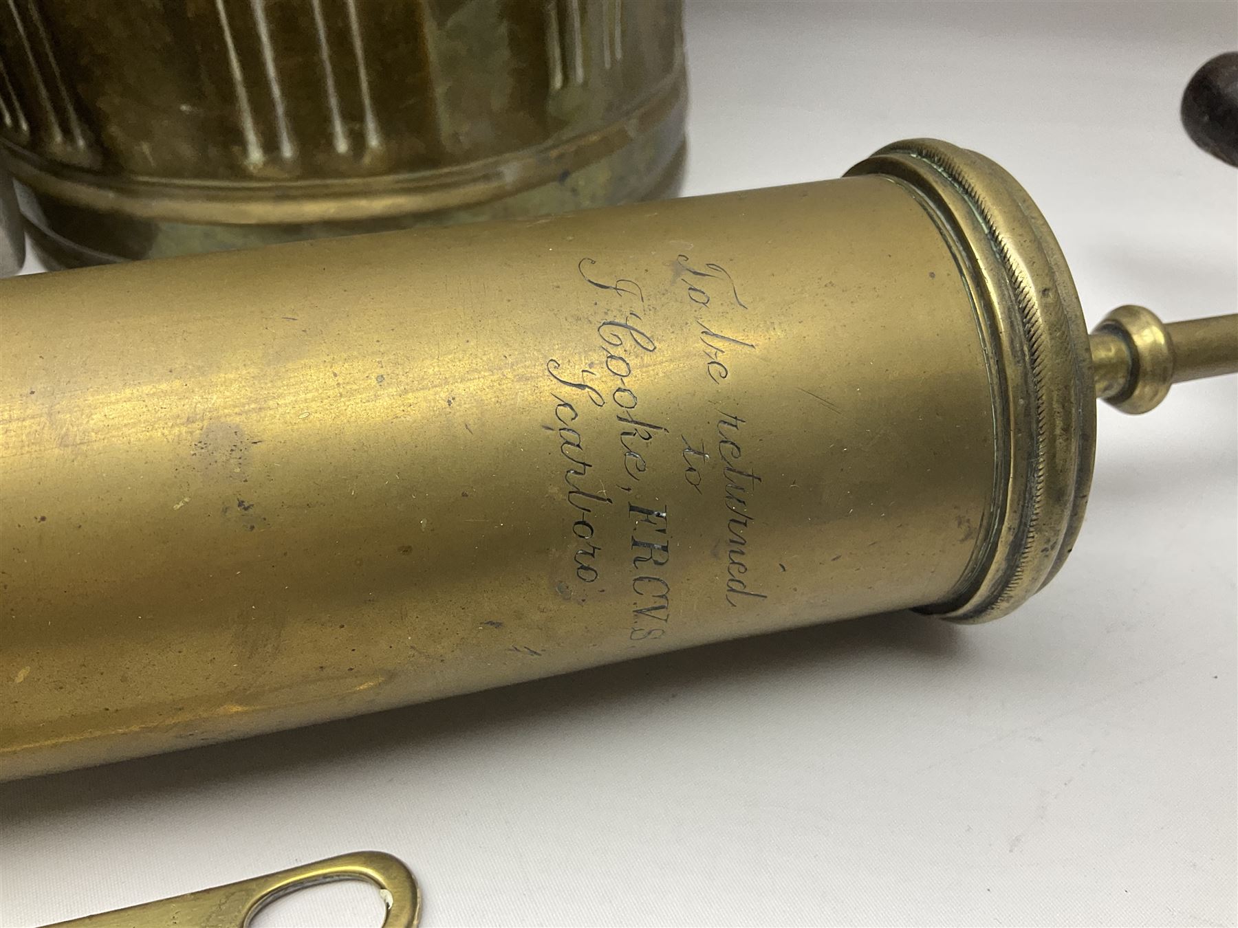 Victorian brass veterinary syringe, with wooden handle, inscribed 'to be returned to J.Cooke FRCV Scarboro' together with a brass jam pan, coal scuttle and spoon and four pewter tankards