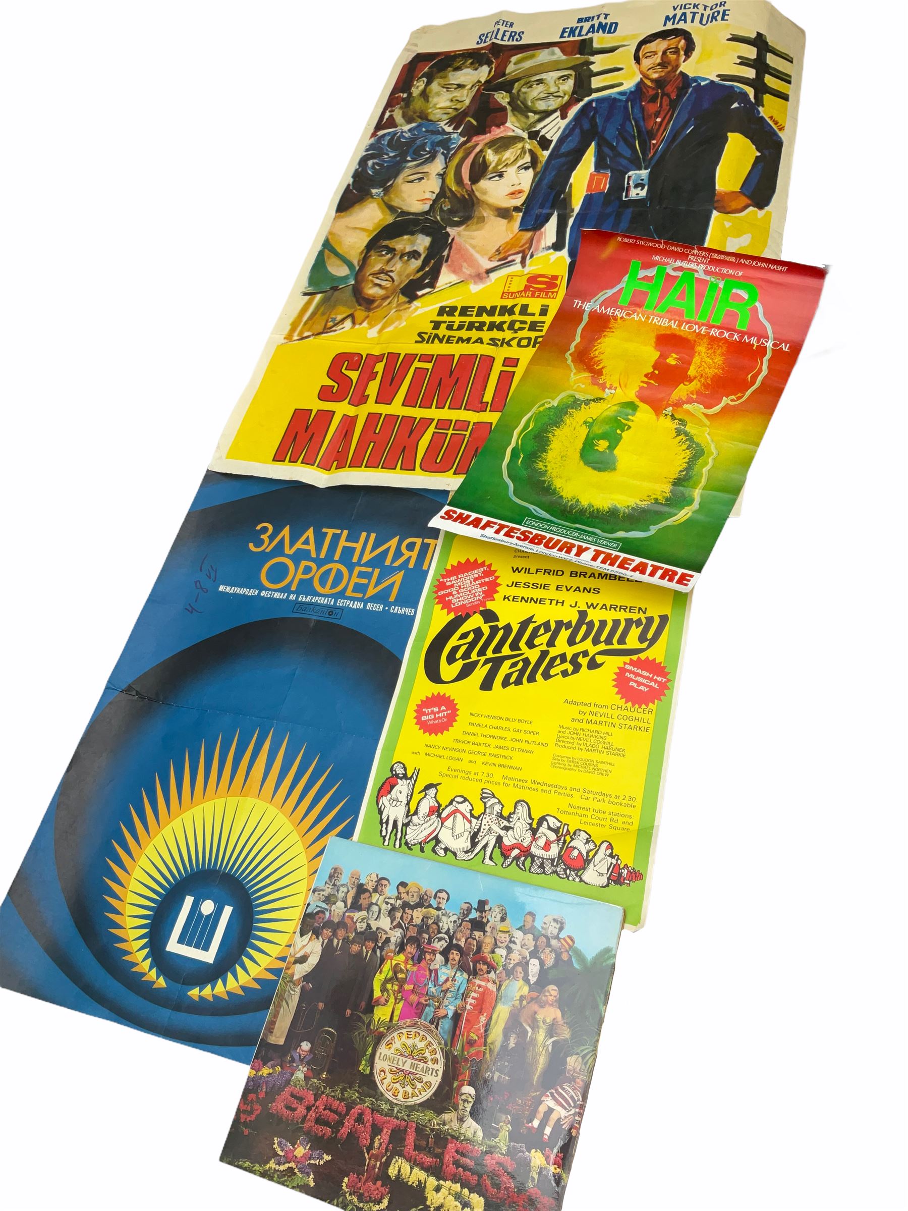 Mid 20th century Turkish film poster, 'Sevimli Mahkum' (After the Fox), H100cm L70cm, together with three other later posters, including one detailed 'Hair The America Tribal Love-Rock Musical', and a Beatles St Peppers Lonely Hearts Club Band vinyl record sleeve. 