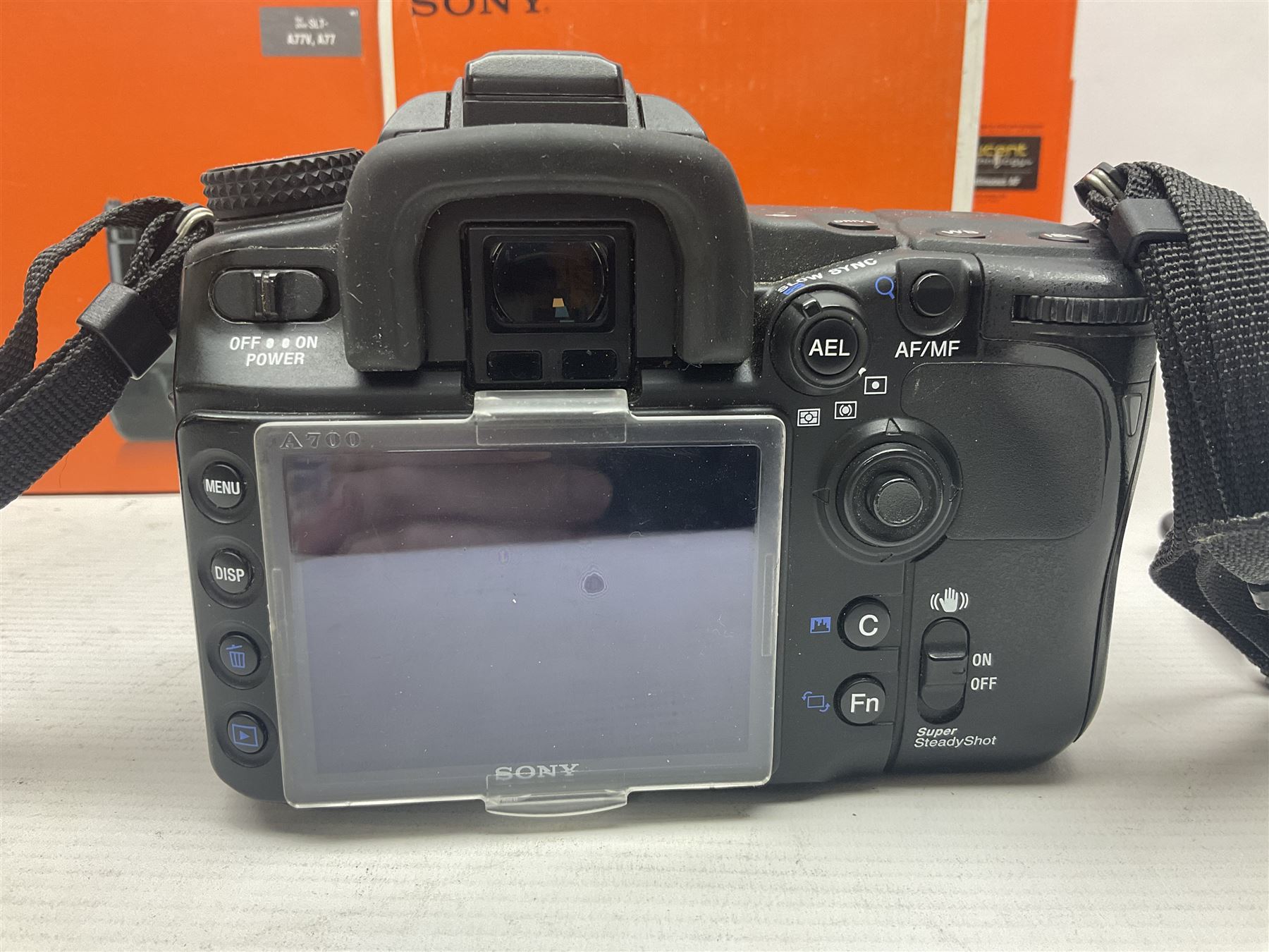 Sony Alpha A700 camera body, serial no 2340937, Sony Alpha A77 camera body, serial no 0715406, together with Sony angle finder and two firm holding grips, all with original boxes  