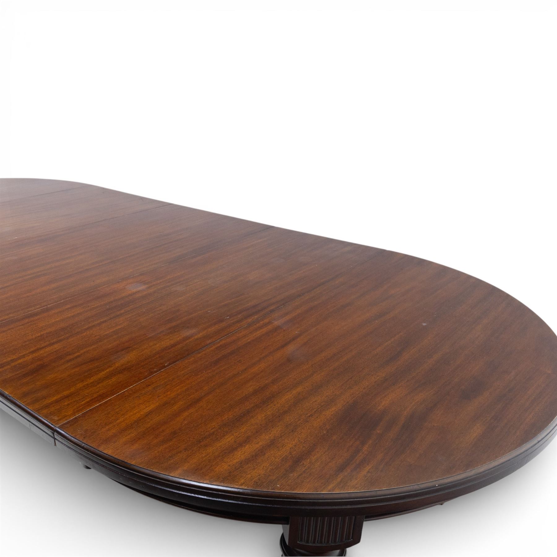 Spillman & Co. London - large Victorian mahogany extending dining table with three additional leaves, upon turned and reeded supports with ceramic castors, bearing ivorine label beneath detailed 'Spillman & Co. St. Martins Lane, London', extends to 302cm