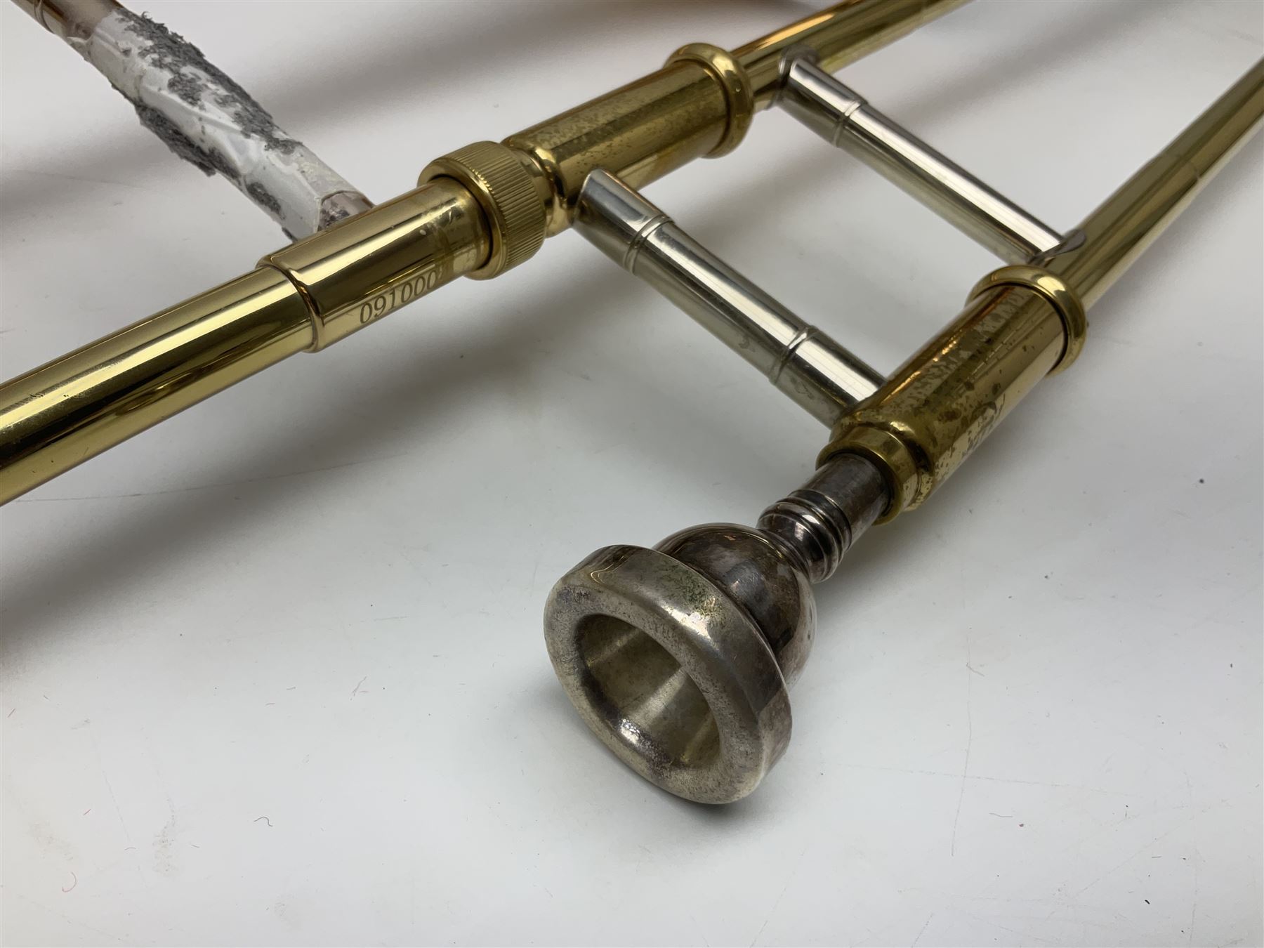 Sebastian Bucklet Aquae Sulis copper and brass trombone No.0910004; in lightweight carrying case; and Kinsman folding tubular chrome music stand in case (2)