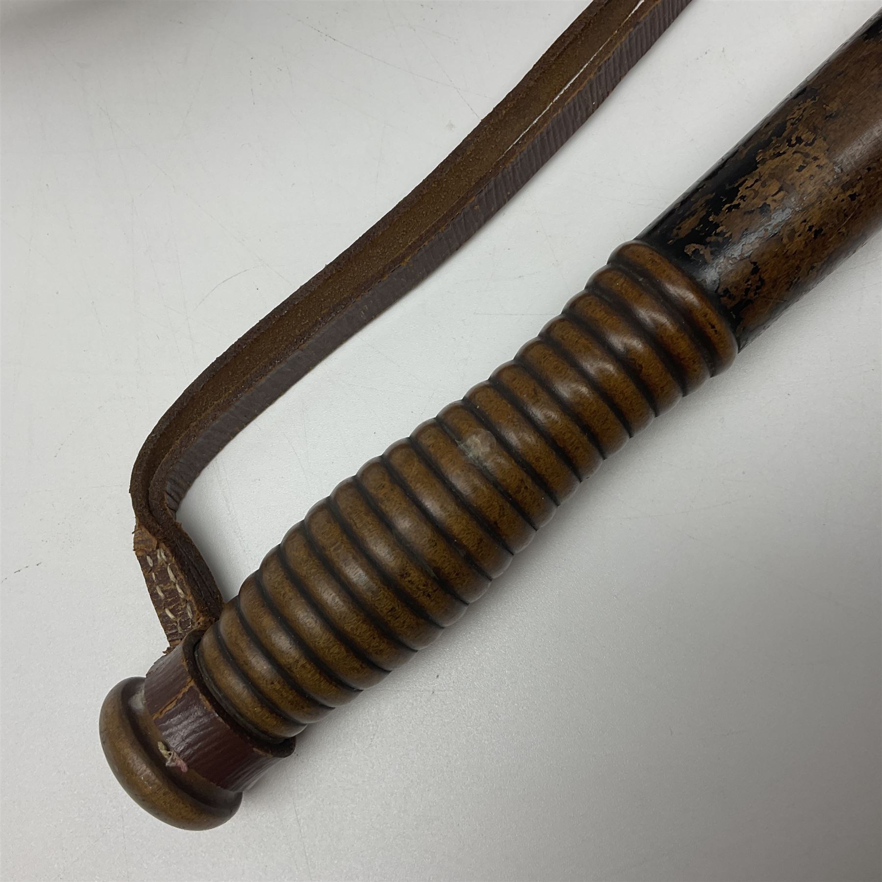 Police - Victorian turned hardwood truncheon with traces of decoration and VR cypher L42cm; Humberside Police helmet with Queens Crown helmet plate; hand lamp inscribed 'The Inspector'; and small pair of pewter figures of police officers (5)