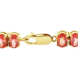 18ct gold padparadscha sapphire bracelet, set with thirty-seven oval cut sapphires, Birmingham 2006, total sapphire weight approx 19.20 carat