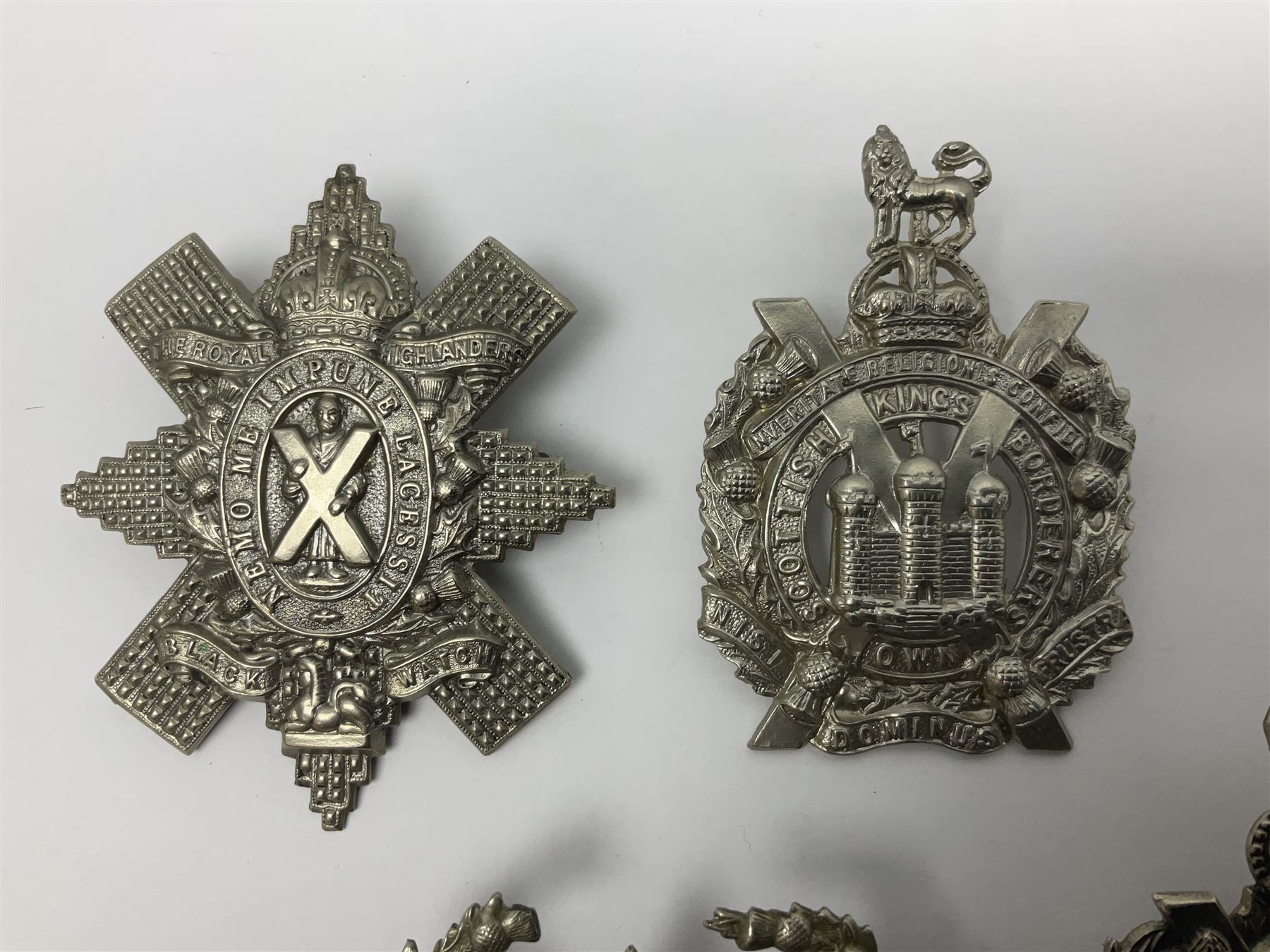 Thirteen Scottish metal Glengarry badges including Black Watch, Highland Regiment, Cameronians, Argyll & Sutherland, Seaforth Highlanders, Kings Scottish Own Borderers etc