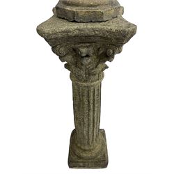 Classical design cast stone female bust depicting Artemis, raised on fluted Corinthian column with acanthus leaf capital, stepped square base, looking right 