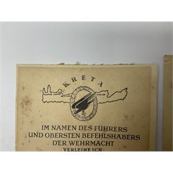 Three German documents dated 1942 - Gold Cross award to Major Ludwig Osterkampf; and Crete wound certificate and cuff title certificate awarded to Feldwebel Alfred Glaise; all unframed (3)