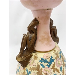 A late 19th century Aesthetic Movement Old Hall vase designed by Christopher Dresser, the flared body decorated with stylised flowering vines, leading to a tapering neck and flared rim with twin figural handles (one s/d), and raised upon a circular footed base, with printed mark beneath, H35cm. 
