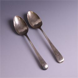 Two George III Old English pattern silver spoons, each engraved with arm and hammer crest to terminal, both hallmarked