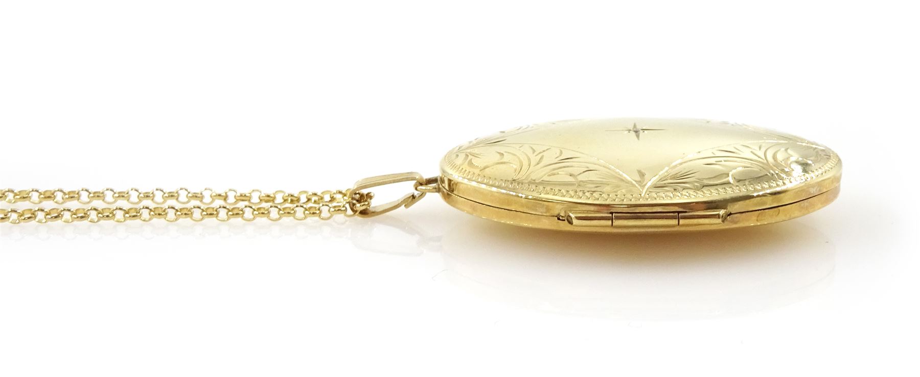 9ct gold hinged locket pendant necklace, with engraved decoration and set with a single diamond chip, hallmarked
