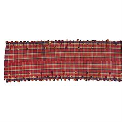South West Persian Jajim kilim flatweave runner, composed of joined narrow woven bands,  field decorated with checked and striped motifs in shades of madder red, indigo, ivory ochre, and green, sides applied knotted wool tufts and braided elements with tasselled edges, (due to the large size, the runner is illustrated in two sections) 