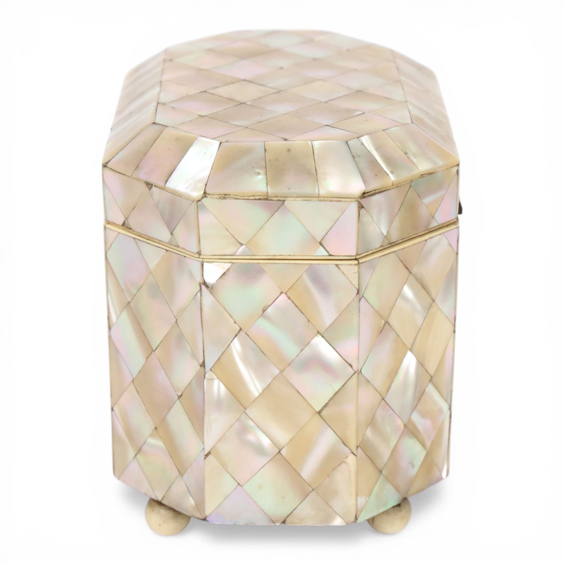 19th century mother of pearl tea caddy, of rectangular form with canted corners, the hinged lid enclosing a single lidded compartment, raised upon bun feet, H11cm D10cm L13cm
This item has been registered for sale under Section 10 of the APHA Ivory Act 