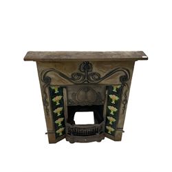 Art Nouveau style iron fireplace, cast floral detail, inset ceramic tiles