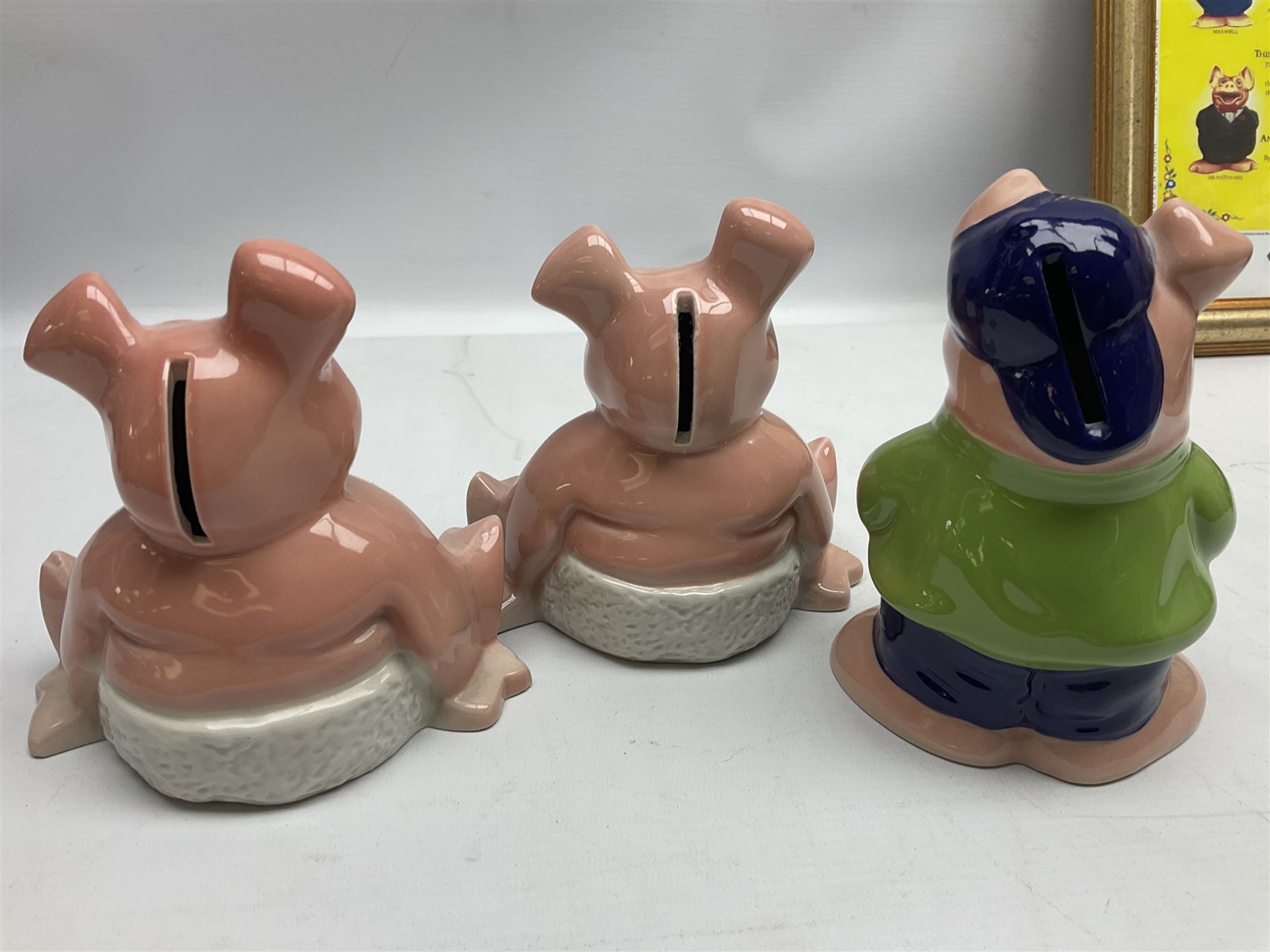  Full Set of Wade Natwest Pigs to include cousin Wesley, with an additional baby and framed leaflet 