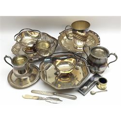 Group of assorted silver plated, to include two swing handle dishes, one with pierced sides, tapering mug, sauce boat with flying scroll handle upon three hoof feet, plus a Victorian silver handled knife, hallmarked for London, etc. 