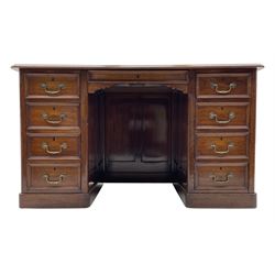 Victorian walnut writing desk, rectangular moulded top with inset leather, fitted with two banks of four drawers, with shallow kneehole drawer, plinth base