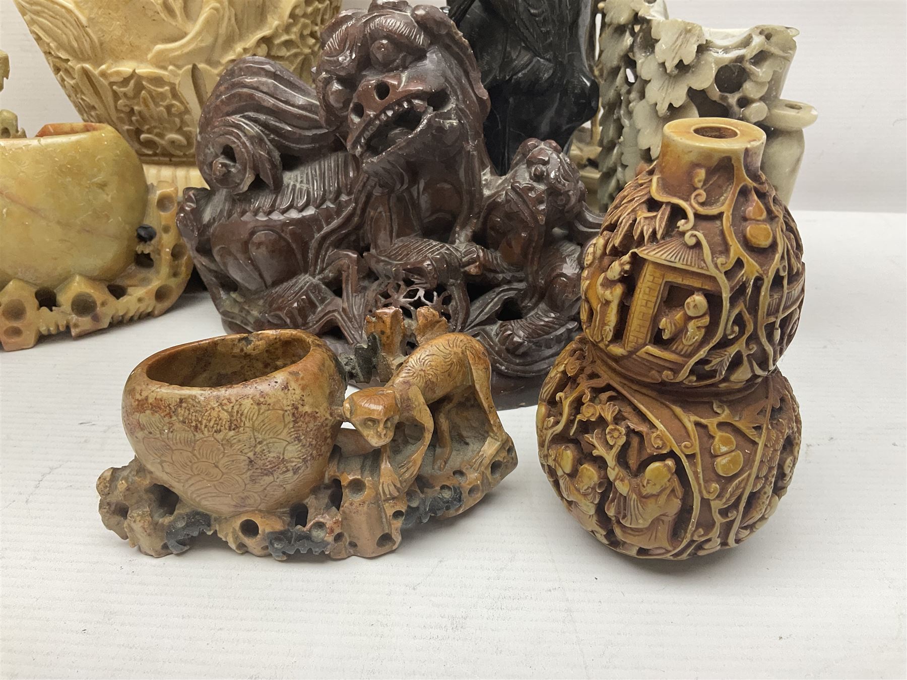Collection of hardstone and soapstone, including hardstone seal carved temple dogs finial, inscription on base, together with inkwells, vases etc  