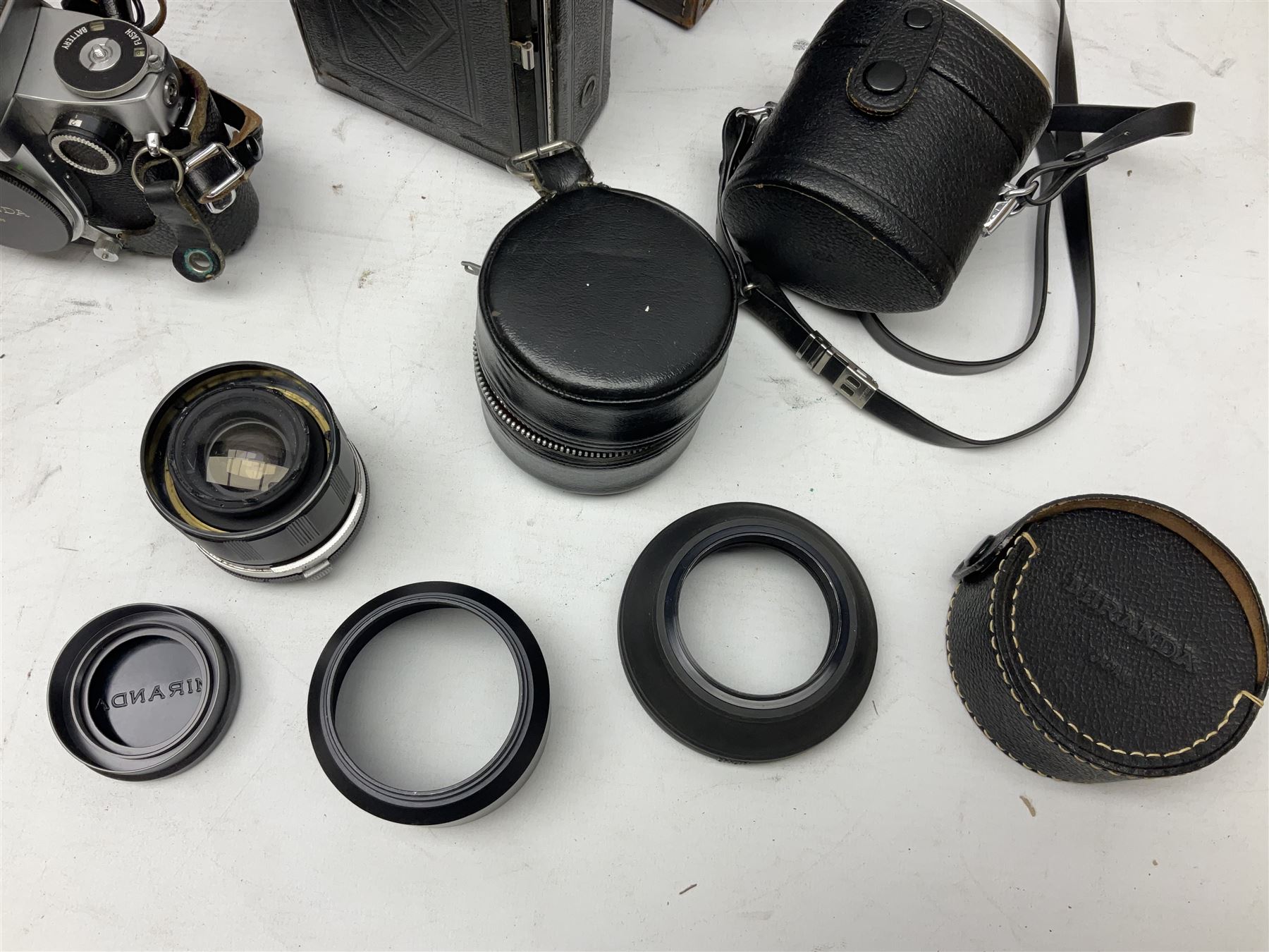 Miranda Sensorex camera body, Miranda Sensorex II camera body with 'Auto Miranda 1:1.8 f-59mm' lens, 'Auto Miranda 1:2.8 f-135mm' lens, 'Auto Miranda 1:3.5 f-200mm' lens, 'Auto Miranda 1:2.8 f-28mm' len, Agfa plate camera with 9cm x 12cm plates and other camera equipment including Miranda camera bag