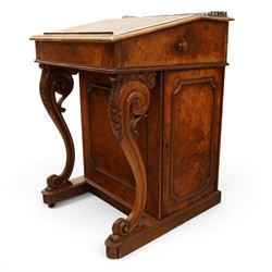 Victorian figured walnut Davenport, the fixed fall with drawer to the side enclosing writing compartment, green tooled leather writing inset, galleried back rail, right side fitted with four drawers behind a panel, opposing panelled side, raised on carved cabriole front supports with scroll terminals and platform base