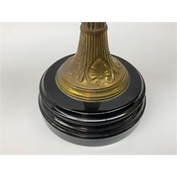 Victorian table standing oil lamp, brass fittings, cranberry glass reservoir, brass column on black enamelled ceramic base, with a frosted glass shade and clear glass chimney, H68cm
