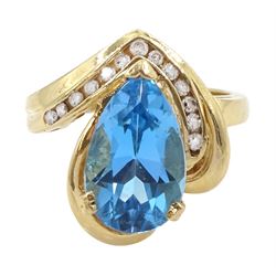 14ct gold pear cut blue topaz and round brilliant cut diamond ring, stamped