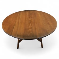 Ercol - dark elm drop leaf oval table, on square supports united by cross stretcher