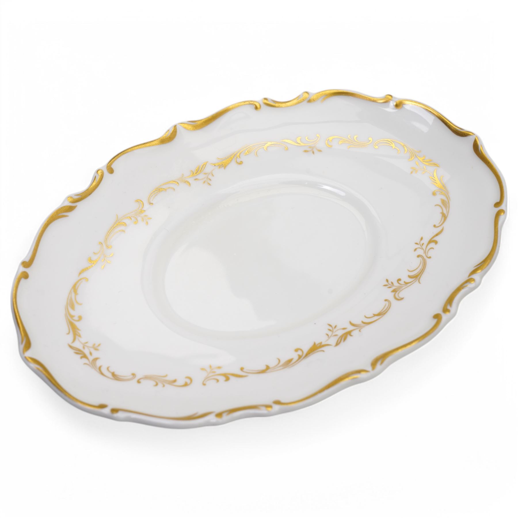 Royal Doulton dinner service in the 'Richelieu' pattern, comprising eleven dinner plates, twenty one dessert plates, twelve soup bowls, eleven dessert bowls, four vegetable dishes, oval serving dishes and graduating meat plates 